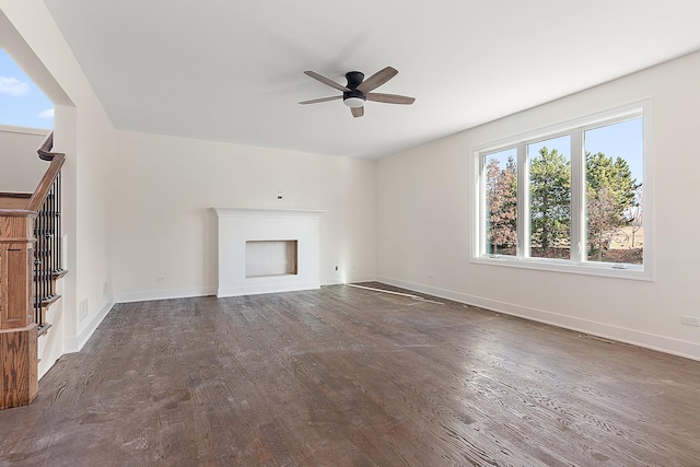 8035 Stanley Trl, Frankfort, IL 60423 - unfurnished living room with a ceiling fan, a fireplace, wood finished floors, and baseboards
