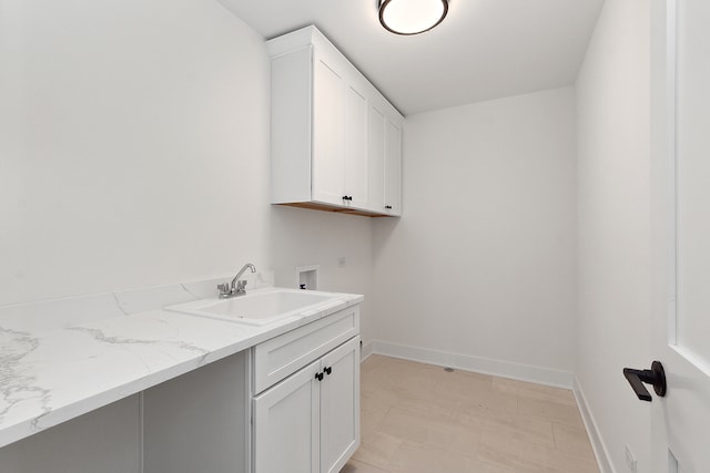 washroom featuring cabinets, washer hookup, and sink