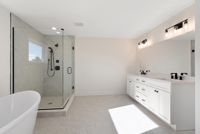 8035 Stanley Trl, Frankfort, IL 60423 - bathroom featuring a freestanding tub, a stall shower, double vanity, marble look tile flooring, and baseboards