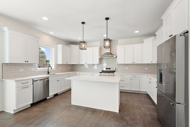 kitchen with a center island, white cabinetry, and stainless steel appliances