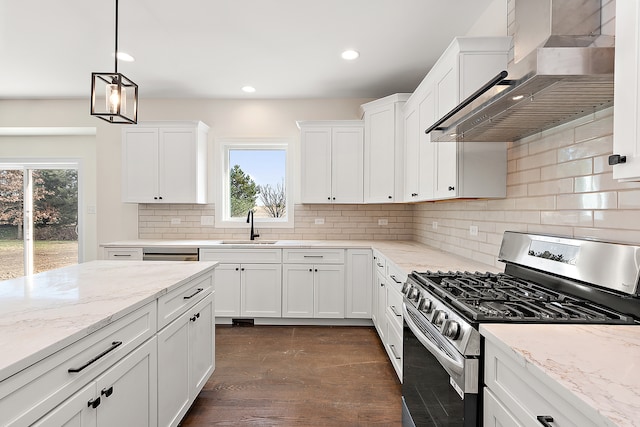 kitchen with white cabinets, wall chimney exhaust hood, a healthy amount of sunlight, and stainless steel range with gas stovetop