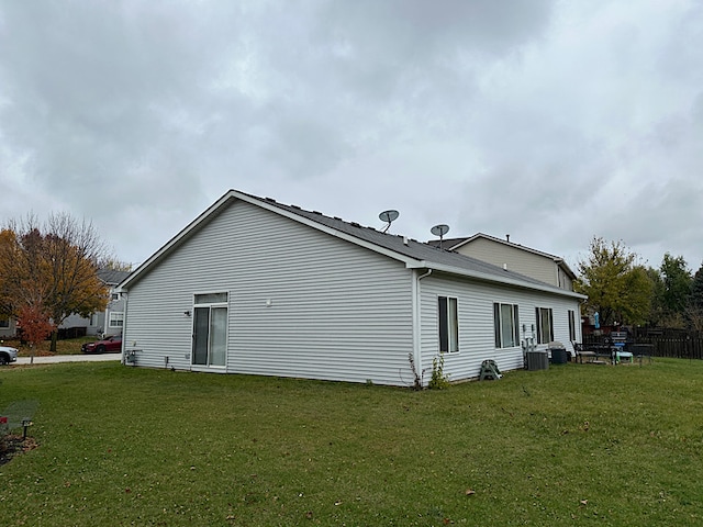 view of side of property with a lawn