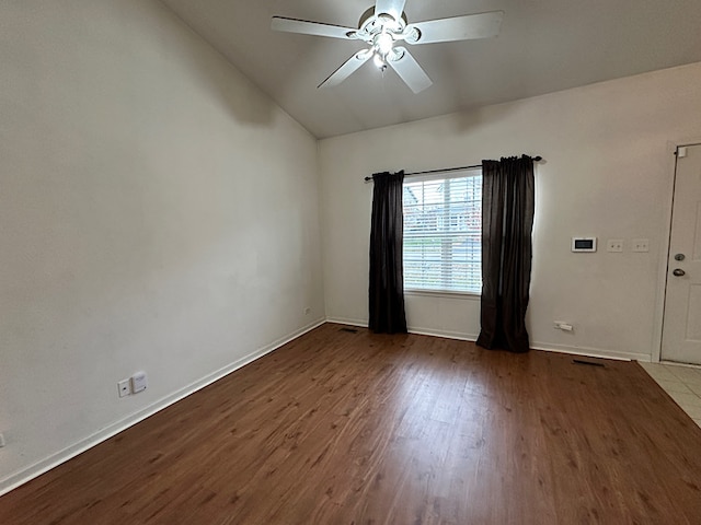 spare room with ceiling fan, light hardwood / wood-style flooring, and lofted ceiling