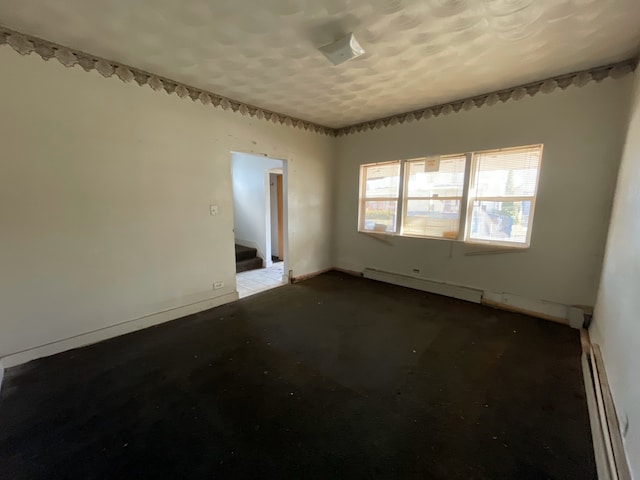 empty room with a baseboard heating unit