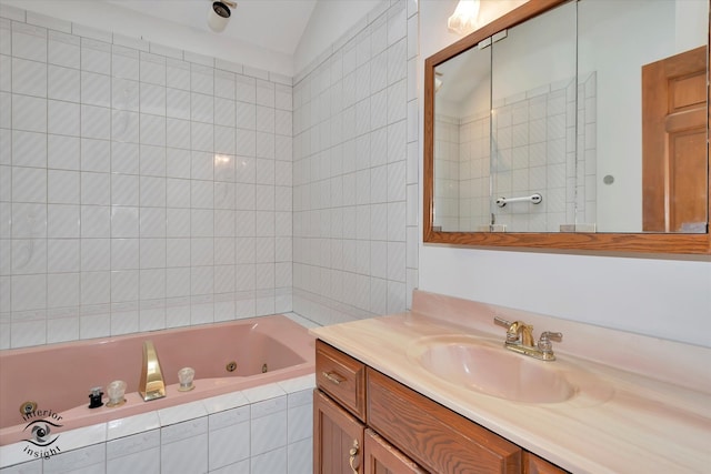 bathroom with vanity, vaulted ceiling, and independent shower and bath