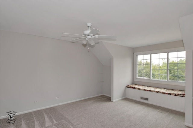 bonus room with light colored carpet and ceiling fan