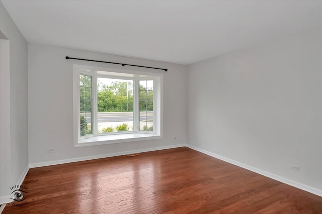 spare room featuring hardwood / wood-style floors