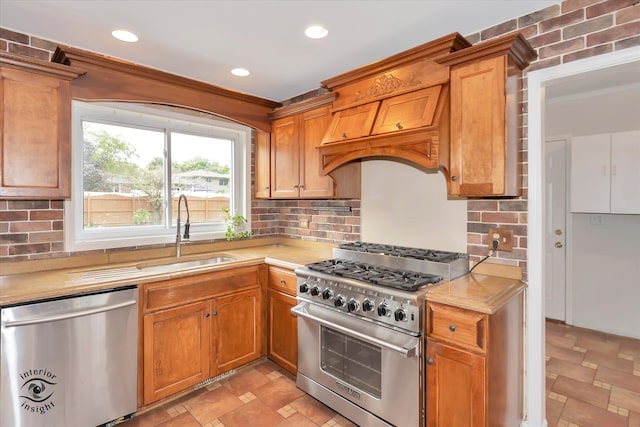 kitchen with backsplash, sink, custom exhaust hood, and appliances with stainless steel finishes