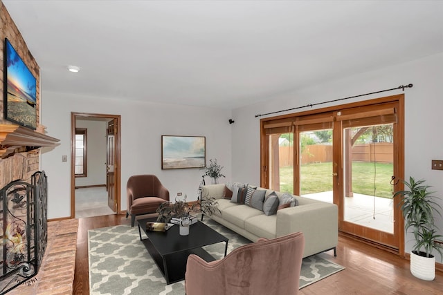 living room featuring light hardwood / wood-style floors and a fireplace