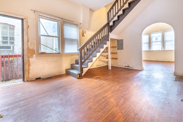 interior space featuring hardwood / wood-style flooring, plenty of natural light, and electric panel