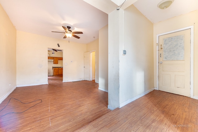 foyer with hardwood / wood-style flooring and ceiling fan