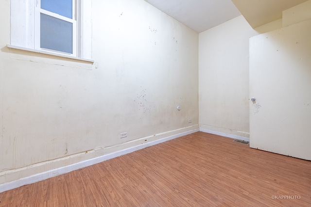 empty room with hardwood / wood-style floors