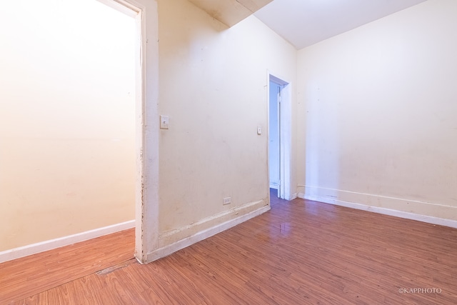 spare room with hardwood / wood-style flooring