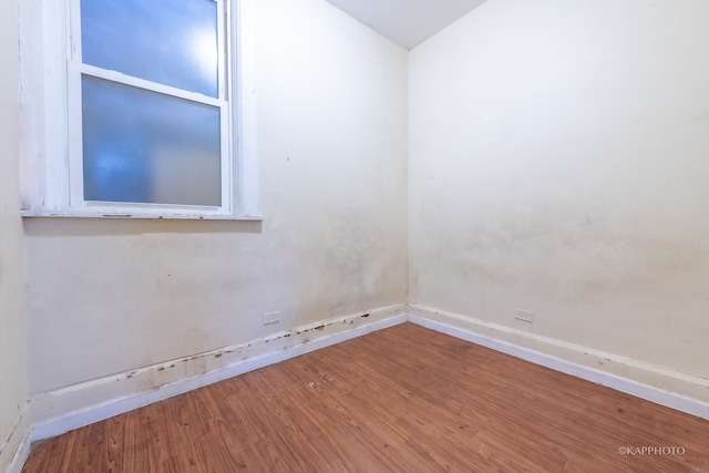 unfurnished room featuring hardwood / wood-style floors