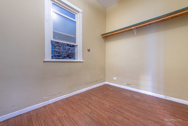 spare room with hardwood / wood-style flooring