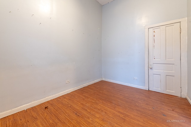 empty room with hardwood / wood-style floors