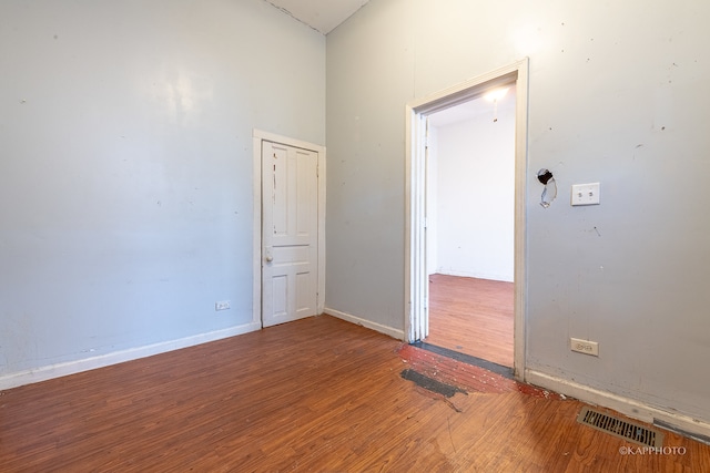 spare room with hardwood / wood-style flooring