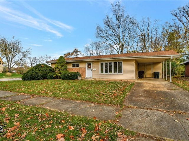 ranch-style home featuring a carport and a front lawn