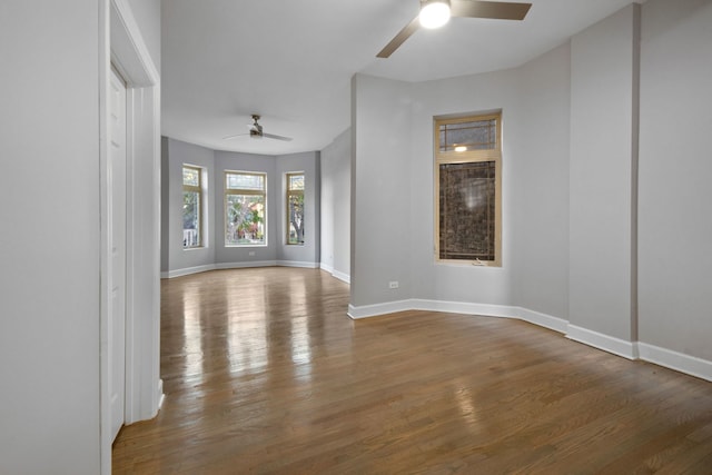 spare room with hardwood / wood-style flooring and ceiling fan