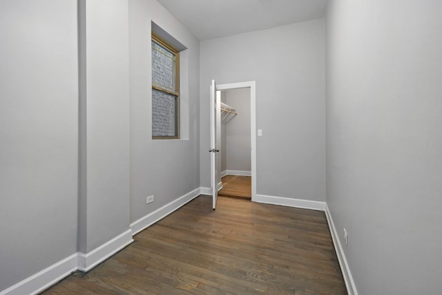 corridor featuring dark hardwood / wood-style floors