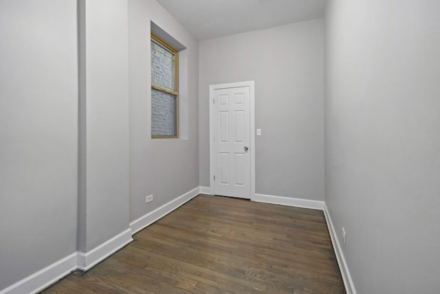 unfurnished room featuring dark hardwood / wood-style floors