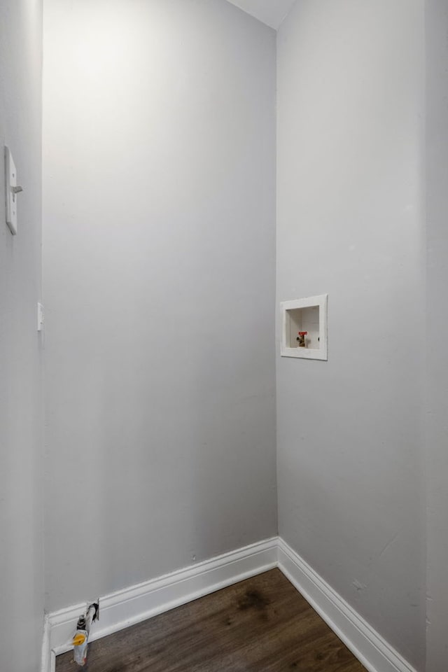 washroom with hookup for a washing machine and dark hardwood / wood-style floors