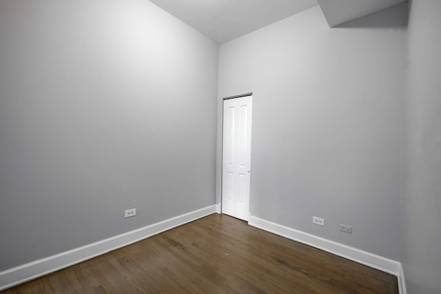 unfurnished room featuring dark hardwood / wood-style flooring