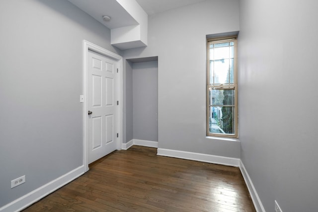 unfurnished room featuring dark hardwood / wood-style floors