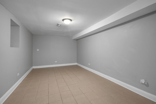 basement with light tile patterned floors