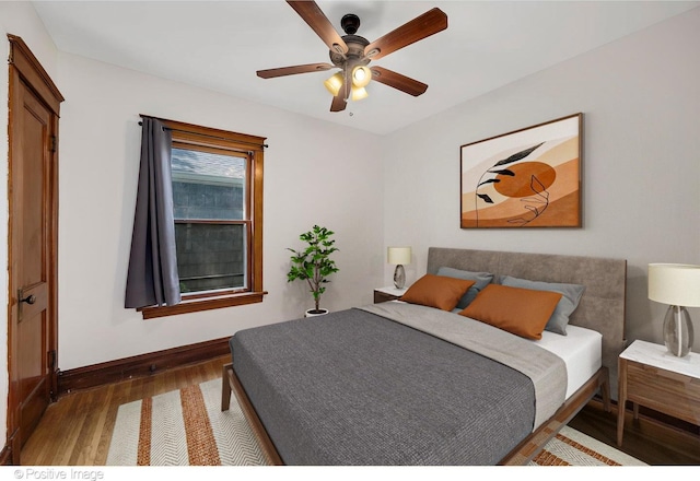 bedroom featuring ceiling fan and wood-type flooring