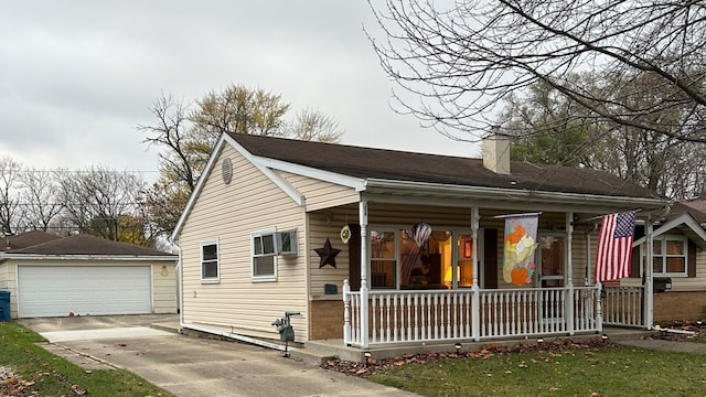 view of front of property with covered porch, an outdoor structure, and a garage