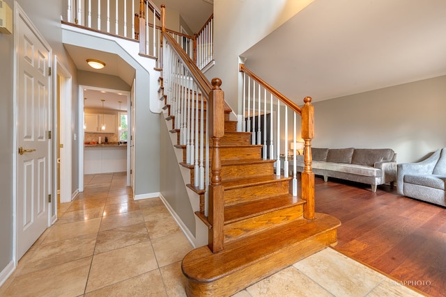 staircase with wood-type flooring