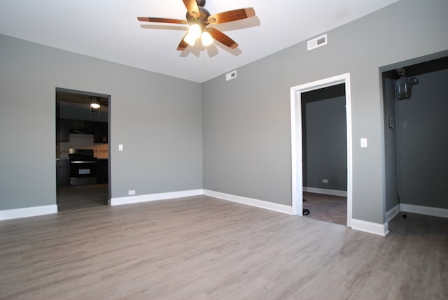 unfurnished room with hardwood / wood-style floors