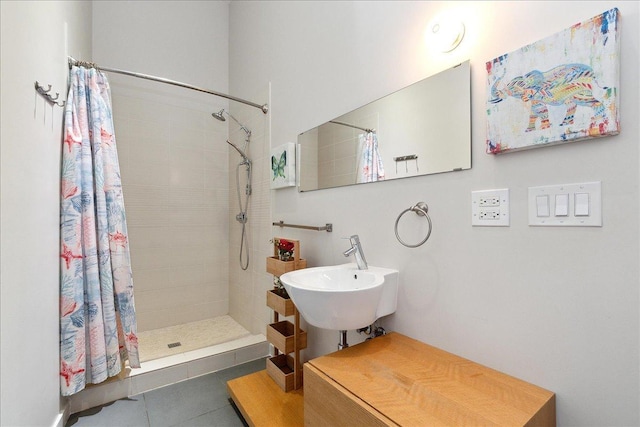 bathroom featuring sink, tile patterned flooring, and walk in shower