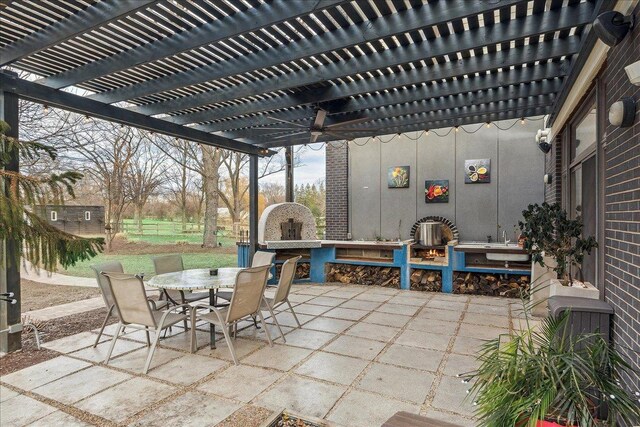 view of patio / terrace with a pergola and ceiling fan