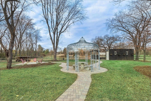 view of yard featuring a gazebo and an outdoor structure