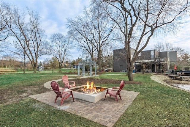 view of yard featuring a fire pit, a patio area, and a gazebo