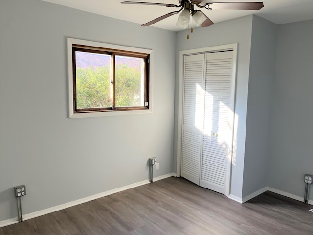 spare room with hardwood / wood-style floors and ceiling fan