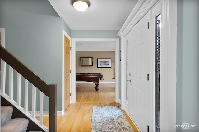 hall with hardwood / wood-style flooring