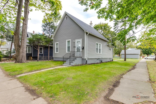 bungalow-style house with a front lawn