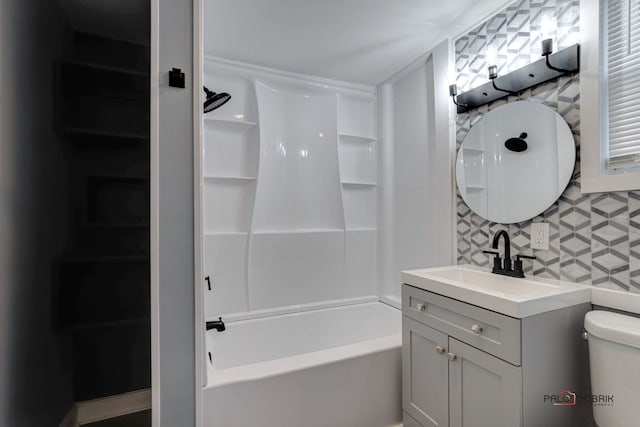 full bathroom with vanity, toilet, and shower / tub combination