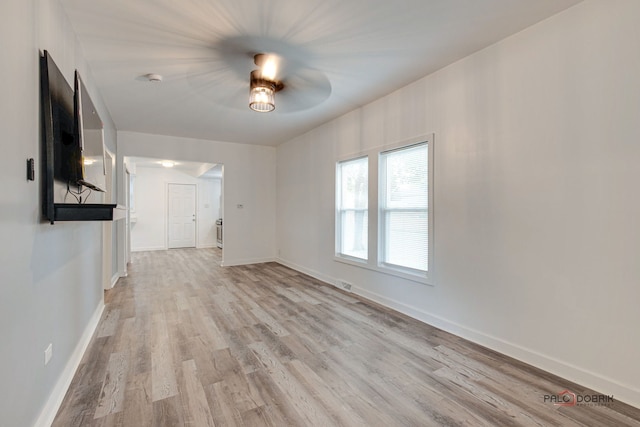 interior space with light hardwood / wood-style flooring and ceiling fan