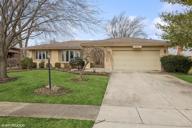 ranch-style house featuring a front yard and a garage