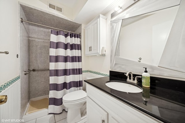 bathroom featuring tile patterned floors, toilet, vanity, and a shower with shower curtain