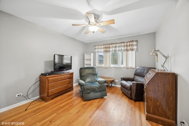 sitting room featuring ceiling fan and light hardwood / wood-style flooring