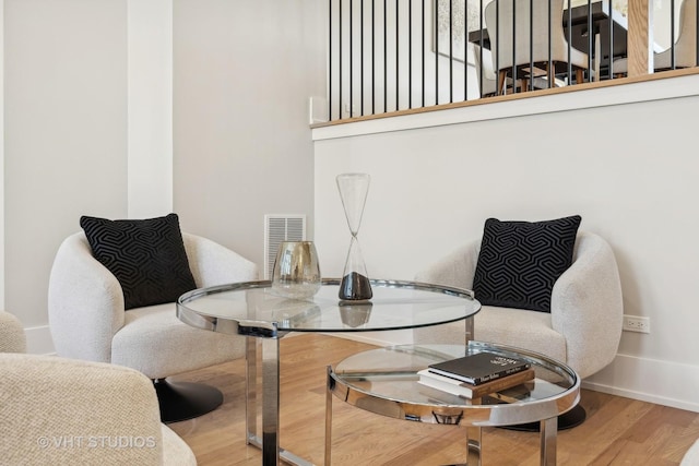 sitting room with hardwood / wood-style floors