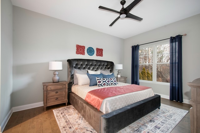 bedroom featuring ceiling fan and dark hardwood / wood-style floors