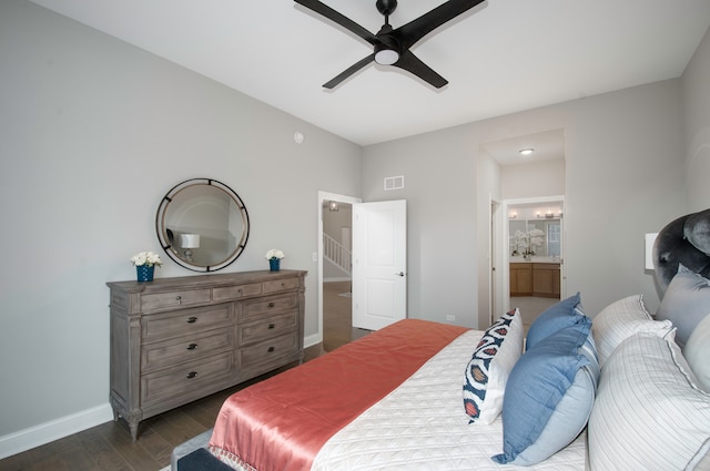 bedroom featuring connected bathroom, dark hardwood / wood-style floors, and ceiling fan