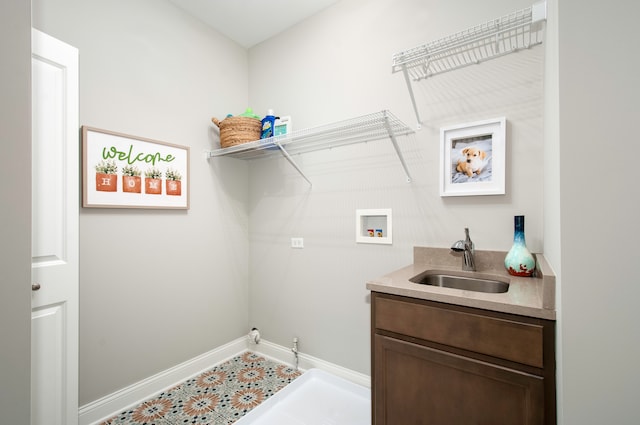 laundry area featuring sink and washer hookup