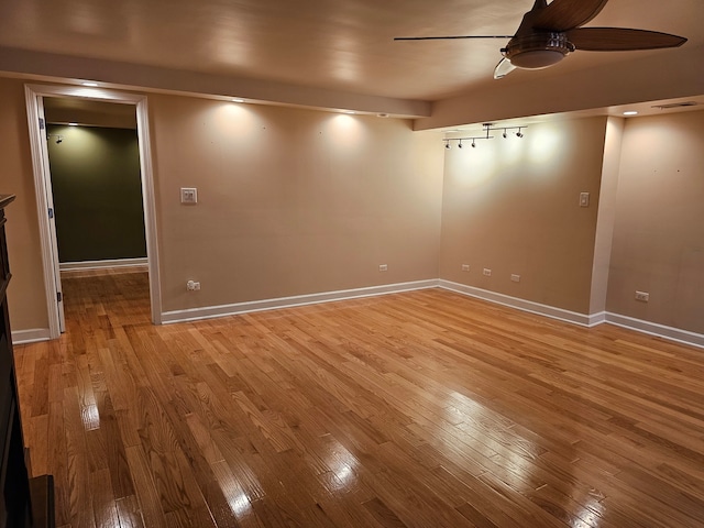 spare room featuring ceiling fan and light hardwood / wood-style floors